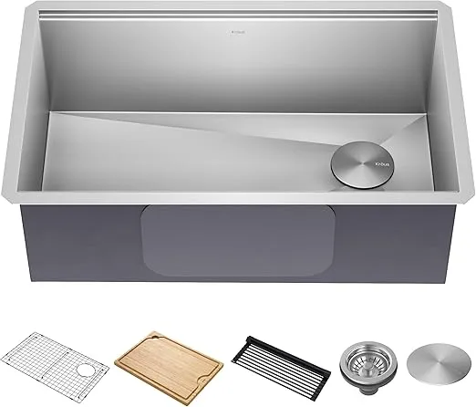 A picture of an undermount kitchen sink with accessories